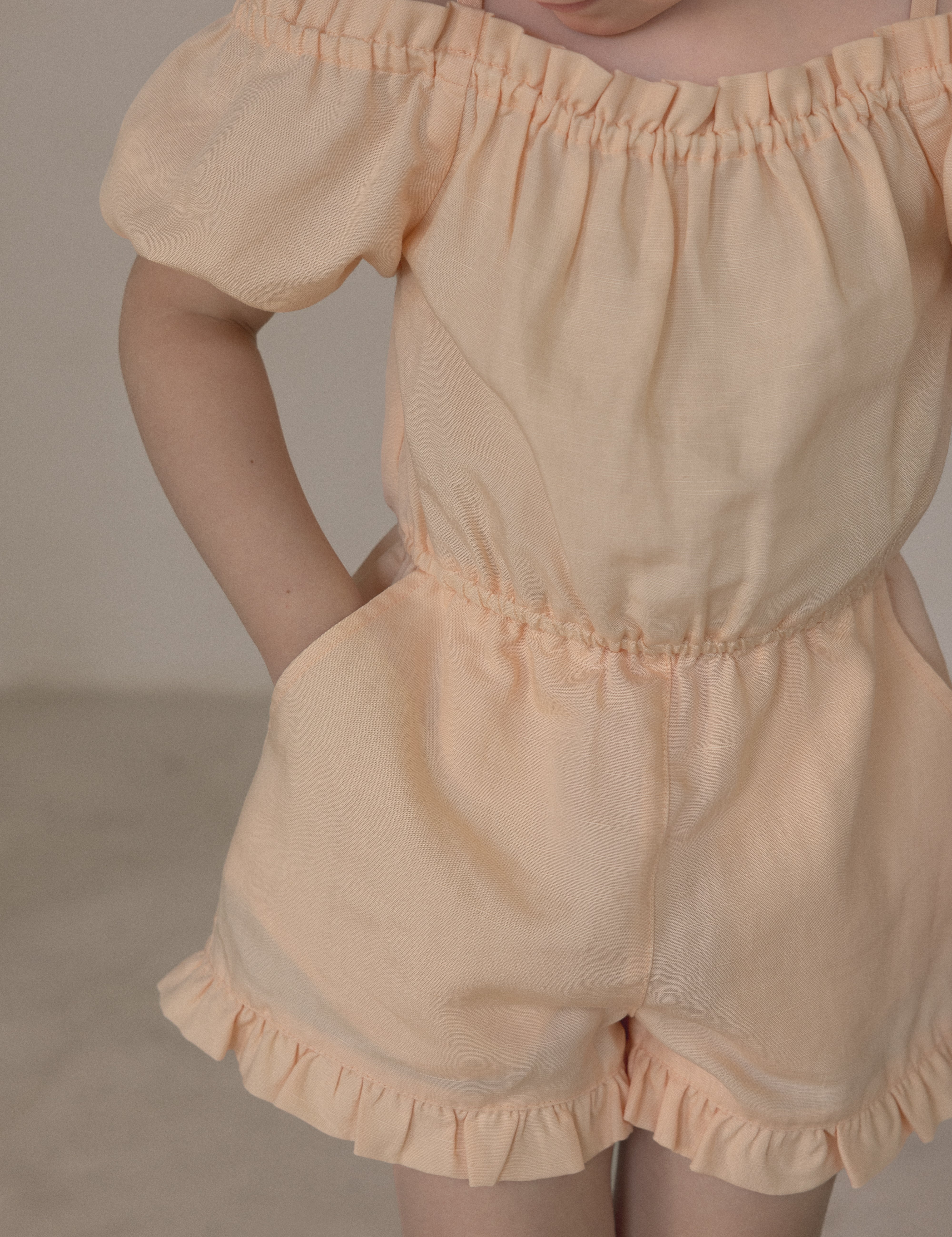 Edith Cold Shoulder Playsuit in tender peach